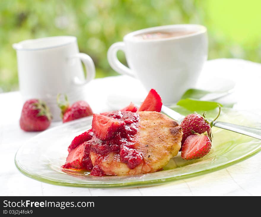 Pancakes with strawberry jam and fresh strawberry