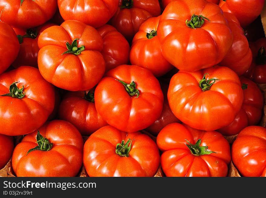 Tomatoes With Stalks In A Market