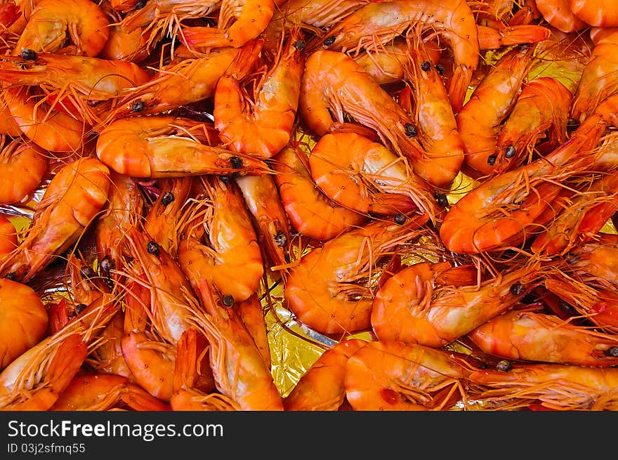 Fresh Shrimp and Prawns in a pile on a market stand