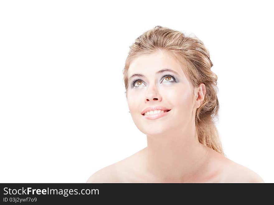 Beautiful dreamy happy young woman looking up