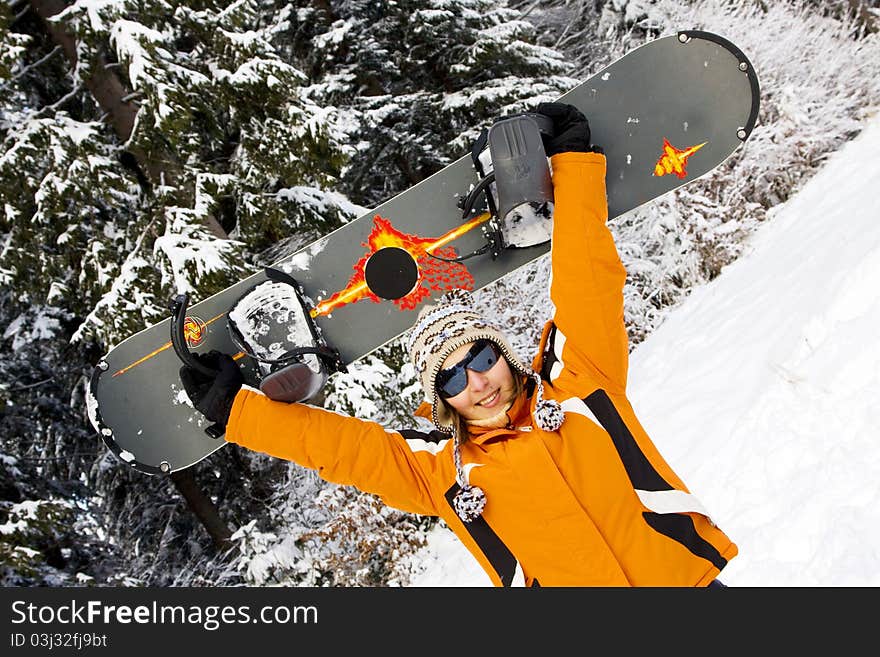 Young woman snowboarder