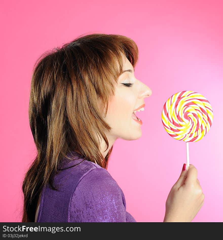 Portrait of brunette with lollipop