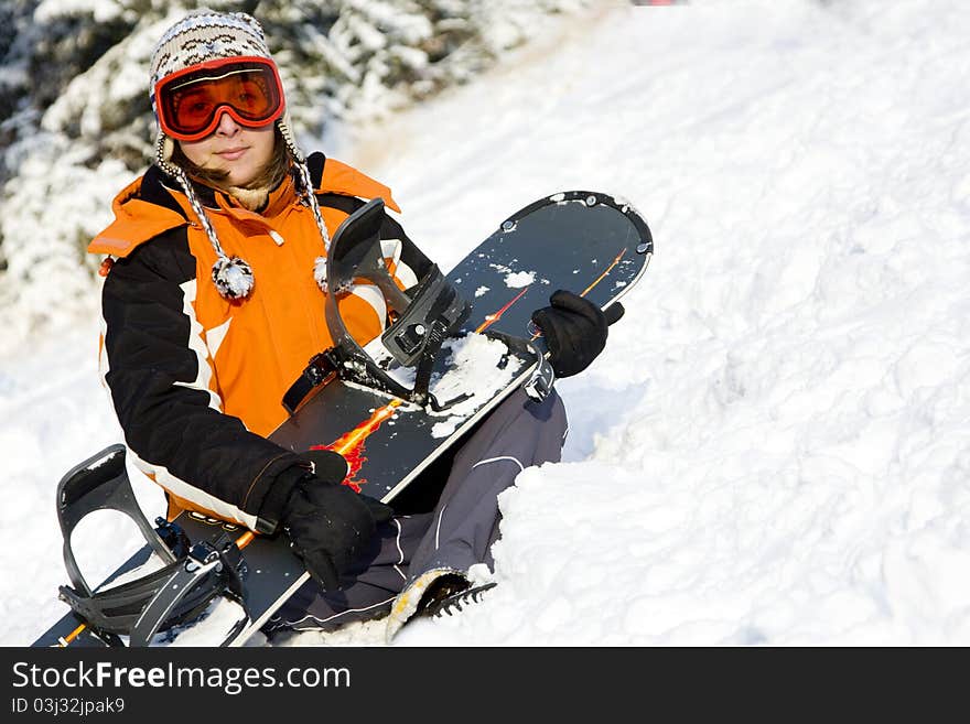 Young woman snowboarder