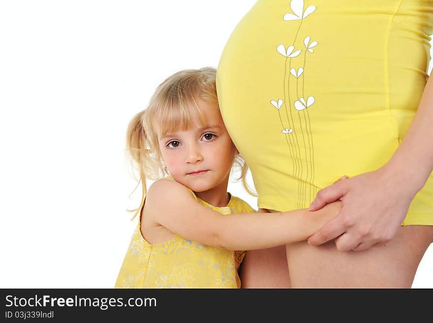 Adorable girl hugging belly pregnant mom's. Adorable girl hugging belly pregnant mom's