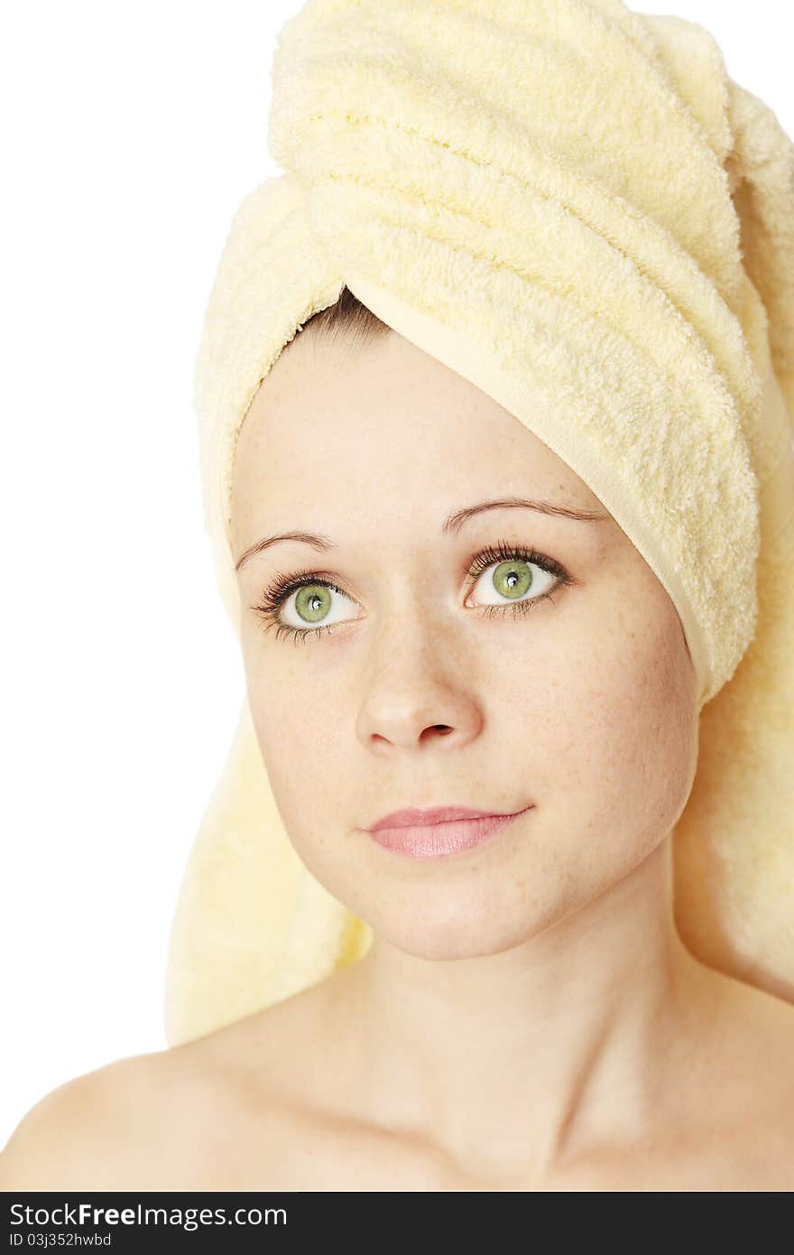 Young beautiful woman in the towel on the head