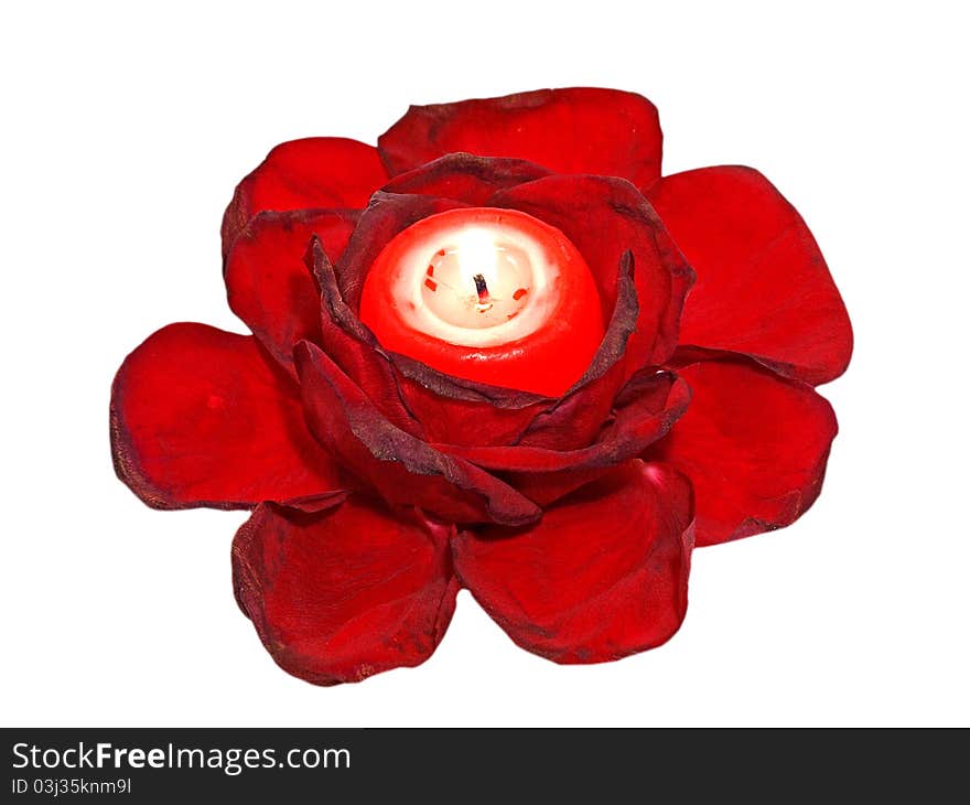 Red roses leavs and glowing candle isolated on white background. Red roses leavs and glowing candle isolated on white background.