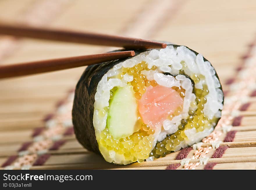 Sushi roll with chop stick