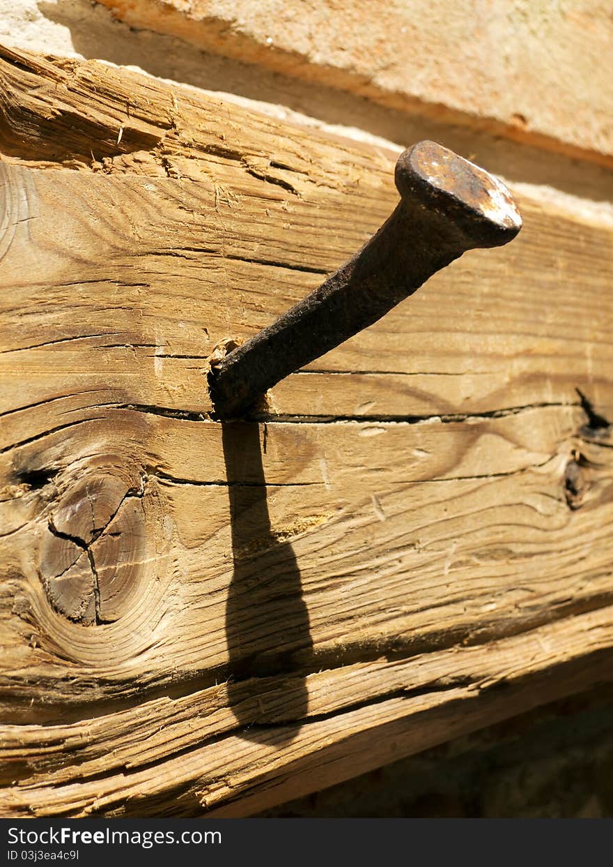 Antique Nail In A Wooden Board