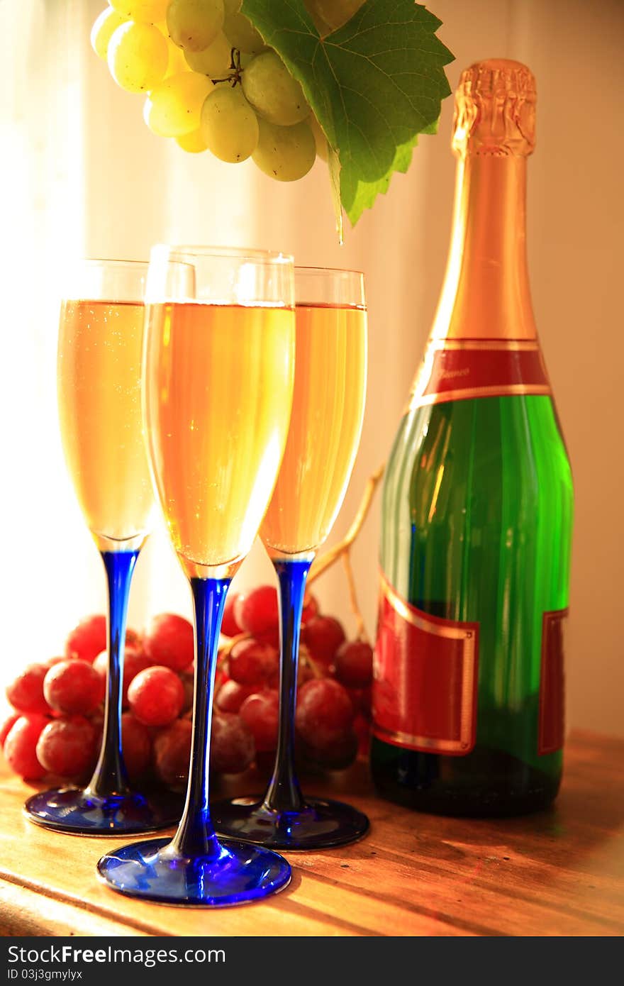 Champagne in glasses, bottle,grapes and grapevine. Champagne in glasses, bottle,grapes and grapevine.