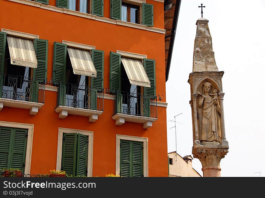 Building exterior details and saint statue in Verona, Italy. Building exterior details and saint statue in Verona, Italy