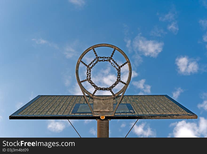 Basketball hoop against a cloudy sky