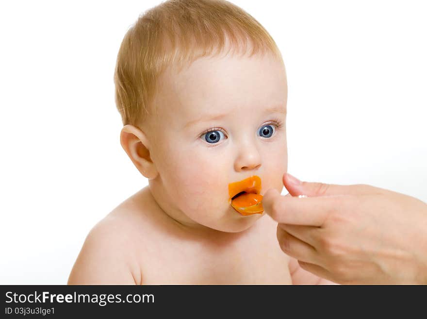 Baby boy feeding isolated on white. Baby boy feeding isolated on white