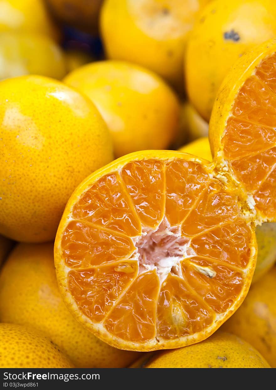 Oranges and half orange from Thailand (Vertical)