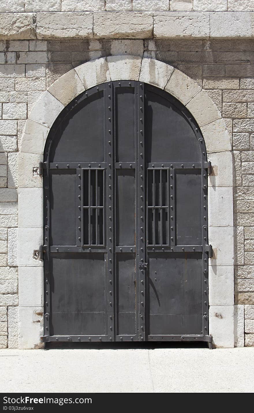 Large Metallic Door And Stone Wall