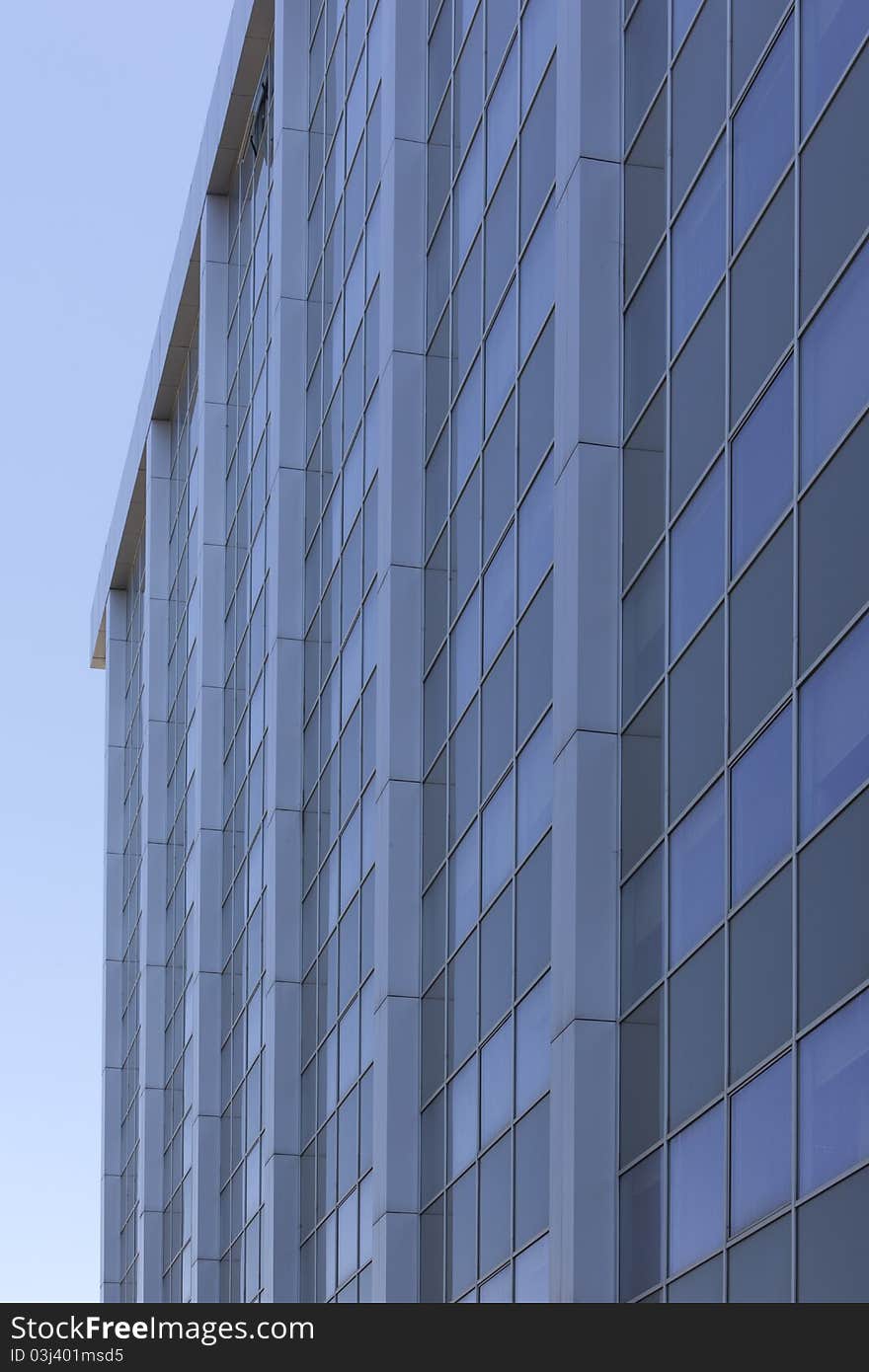 Perspective of a glass facade of a large modern office building. Perspective of a glass facade of a large modern office building