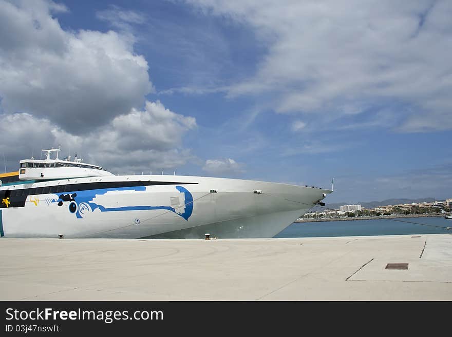 Fast boat anchored in s small port