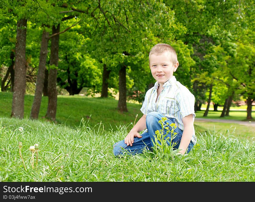 Portrait of a happy boy outdoor in a park