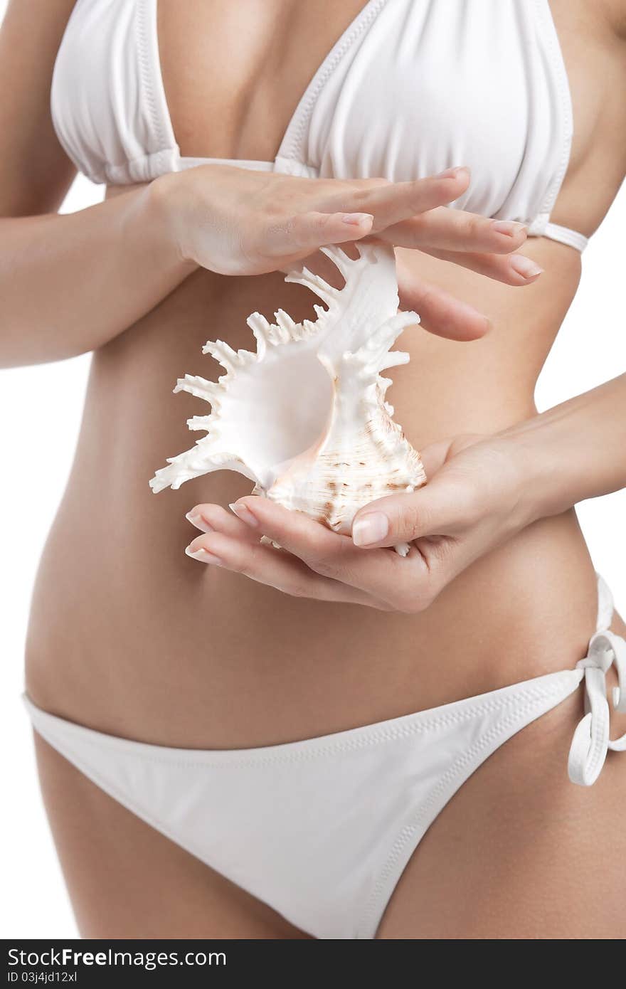 Beautiful woman in white bikini holding shell, seashell. Beautiful woman in white bikini holding shell, seashell