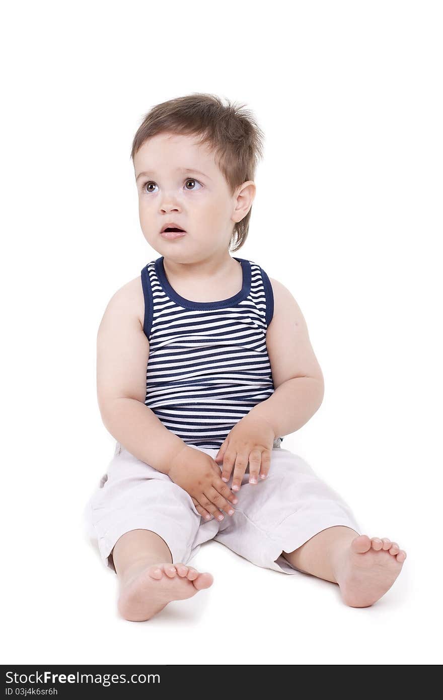 Small cute boy is not happy on a white background. Small cute boy is not happy on a white background