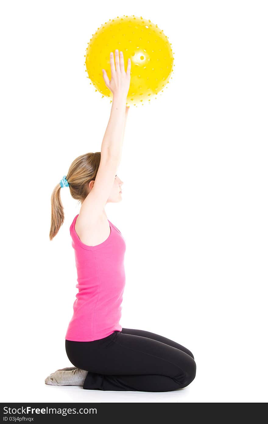 Teenager with a ball on a white background.