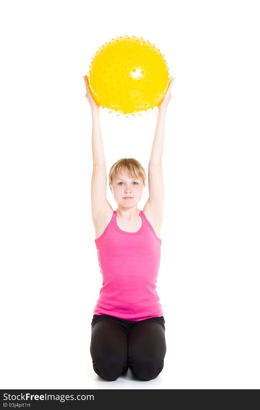 Teenager with a ball on a white background.