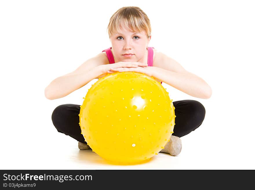 Teenager with a ball on a white background.