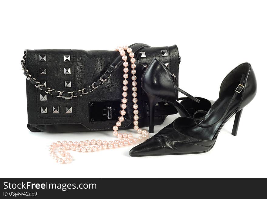 Classic black purse and shoe isolated on a white background. Classic black purse and shoe isolated on a white background