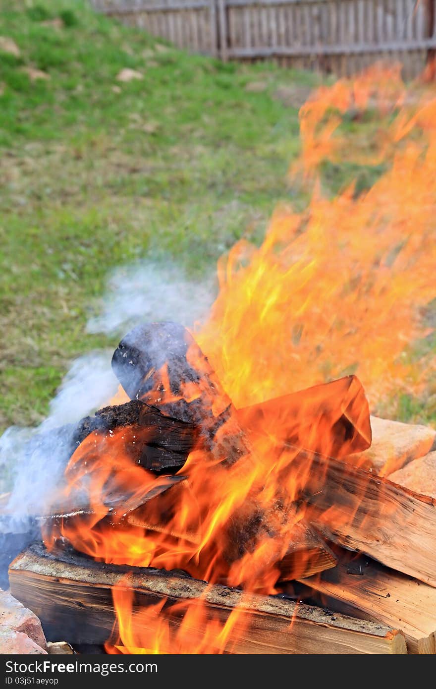 Fire burning on the green meadow. Fire burning on the green meadow