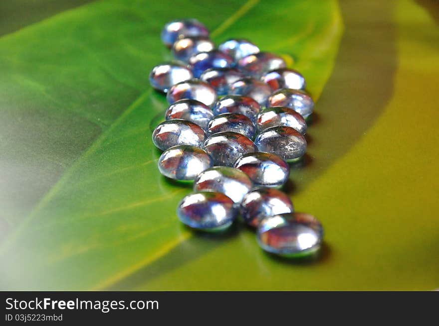 Glass balls on a green table