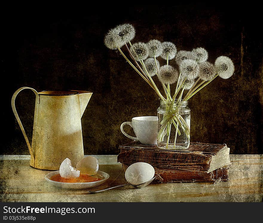 Dandelions and eggs on a table