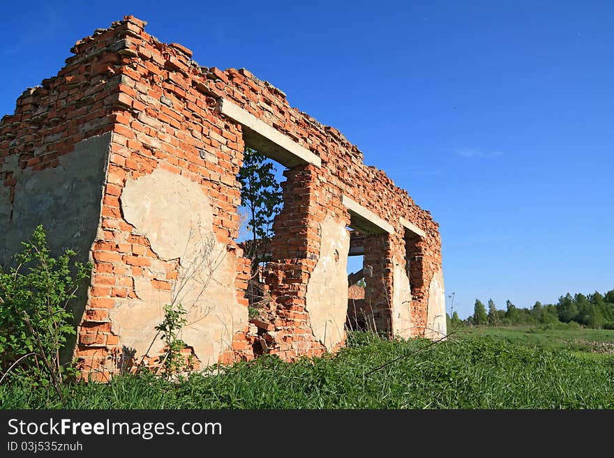 Ruined brick house in the meadow. Ruined brick house in the meadow