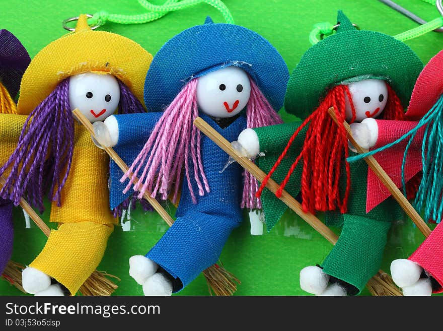 Three snow witch doll with green background