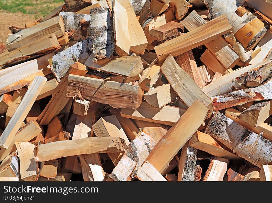 Dry wood in a big pile. Dry wood in a big pile