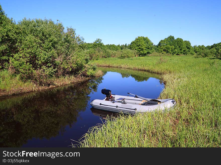 Rubber boat on coast river