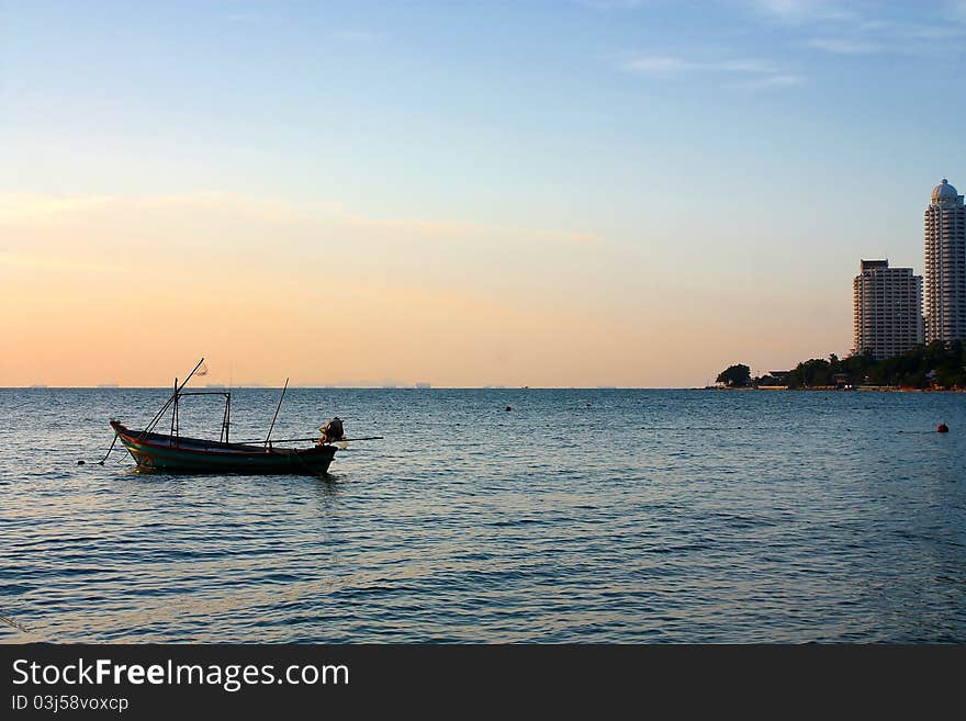 Fisherman boat with a sunset