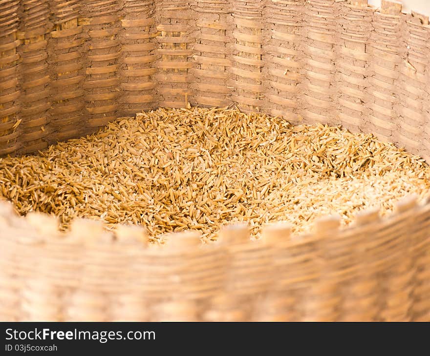 Brown paddy in wicker basket