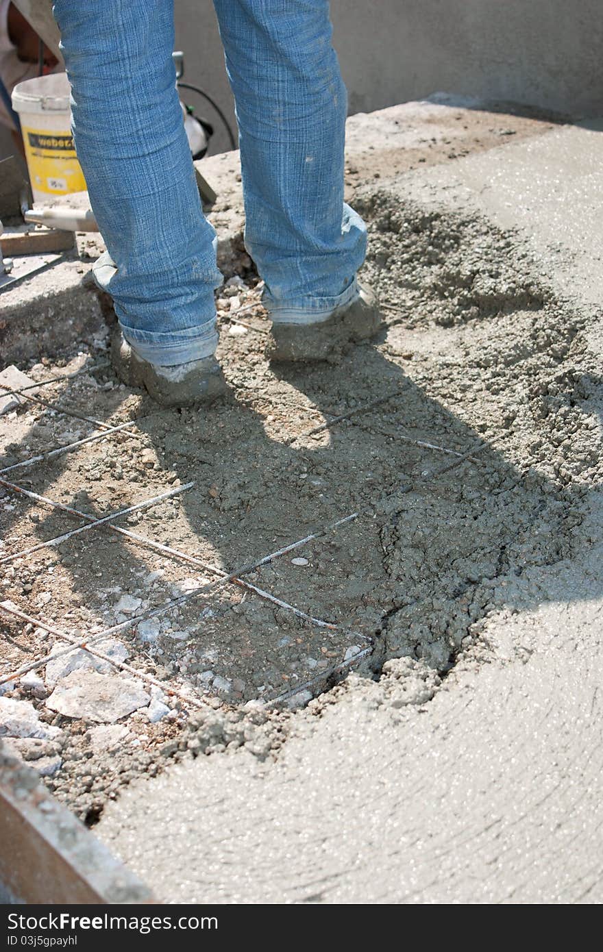 Mason building a screed coat cement. Mason building a screed coat cement