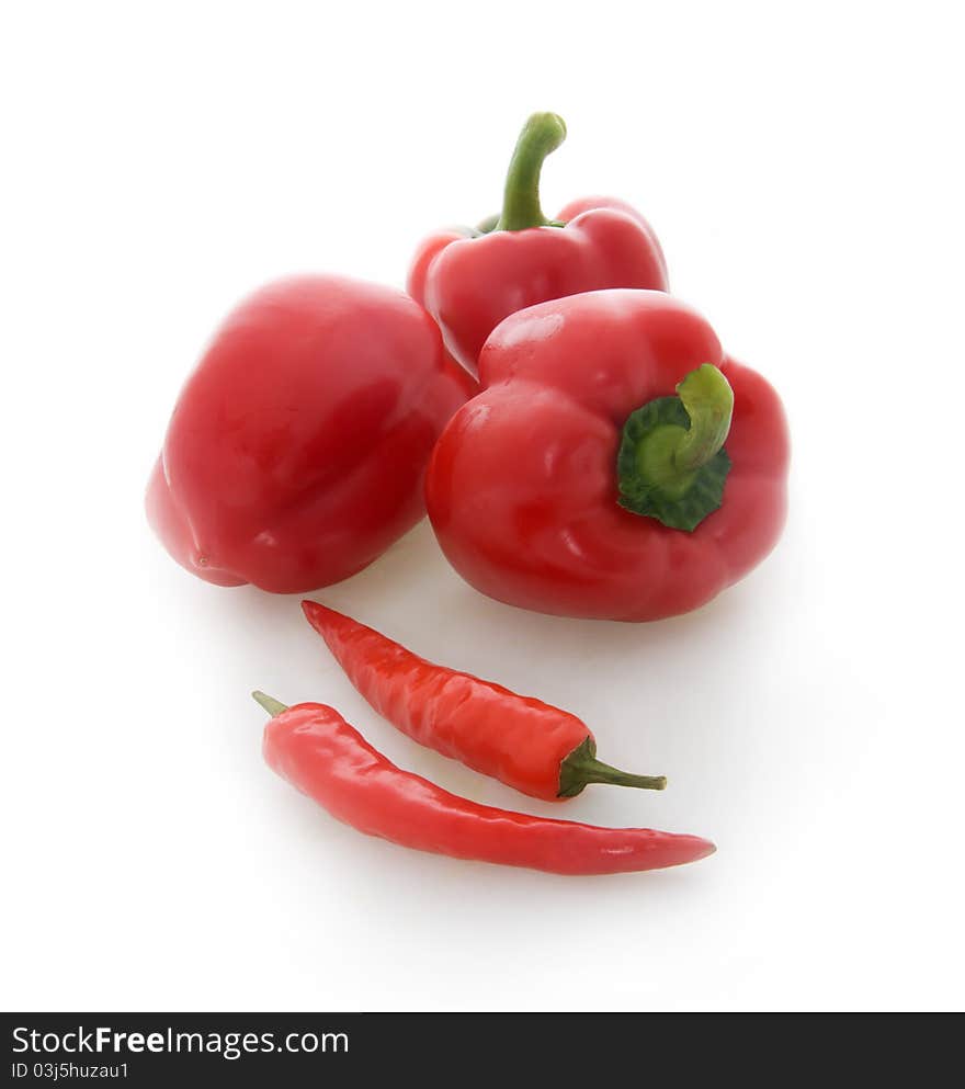 Red chili and red peppers isolated on a white background