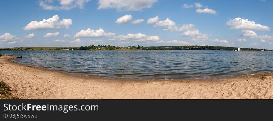 Panoramic lake the sky and clouds. Panoramic lake the sky and clouds