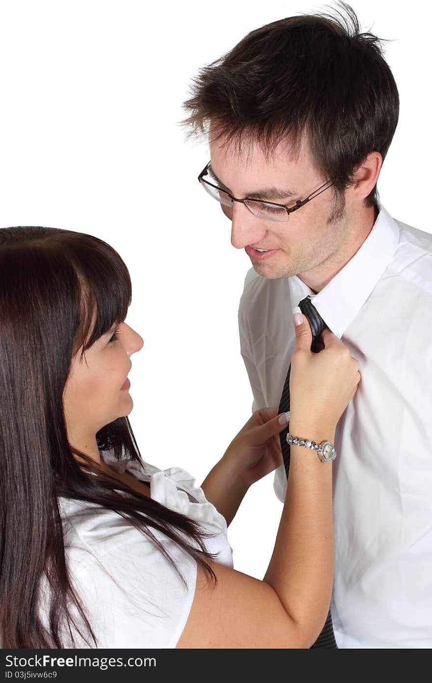 Lady helping man with necktie on a white background