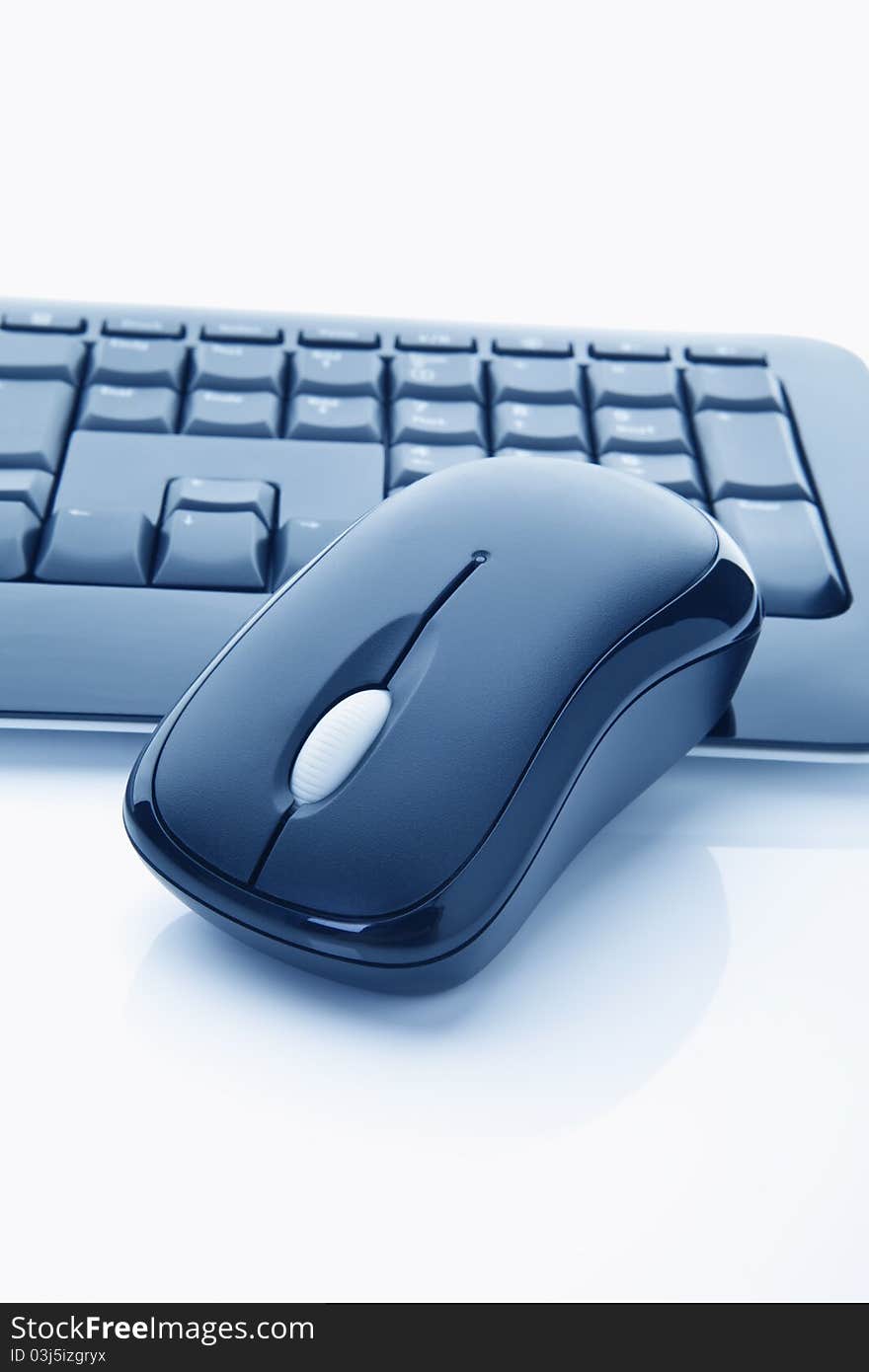 Close-up of a keyboard and a mouse on white background. Close-up of a keyboard and a mouse on white background