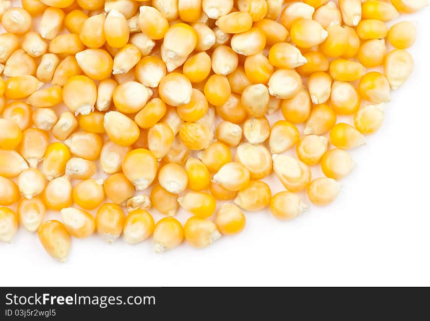 Pile of uncooked popcorn in white background. Pile of uncooked popcorn in white background