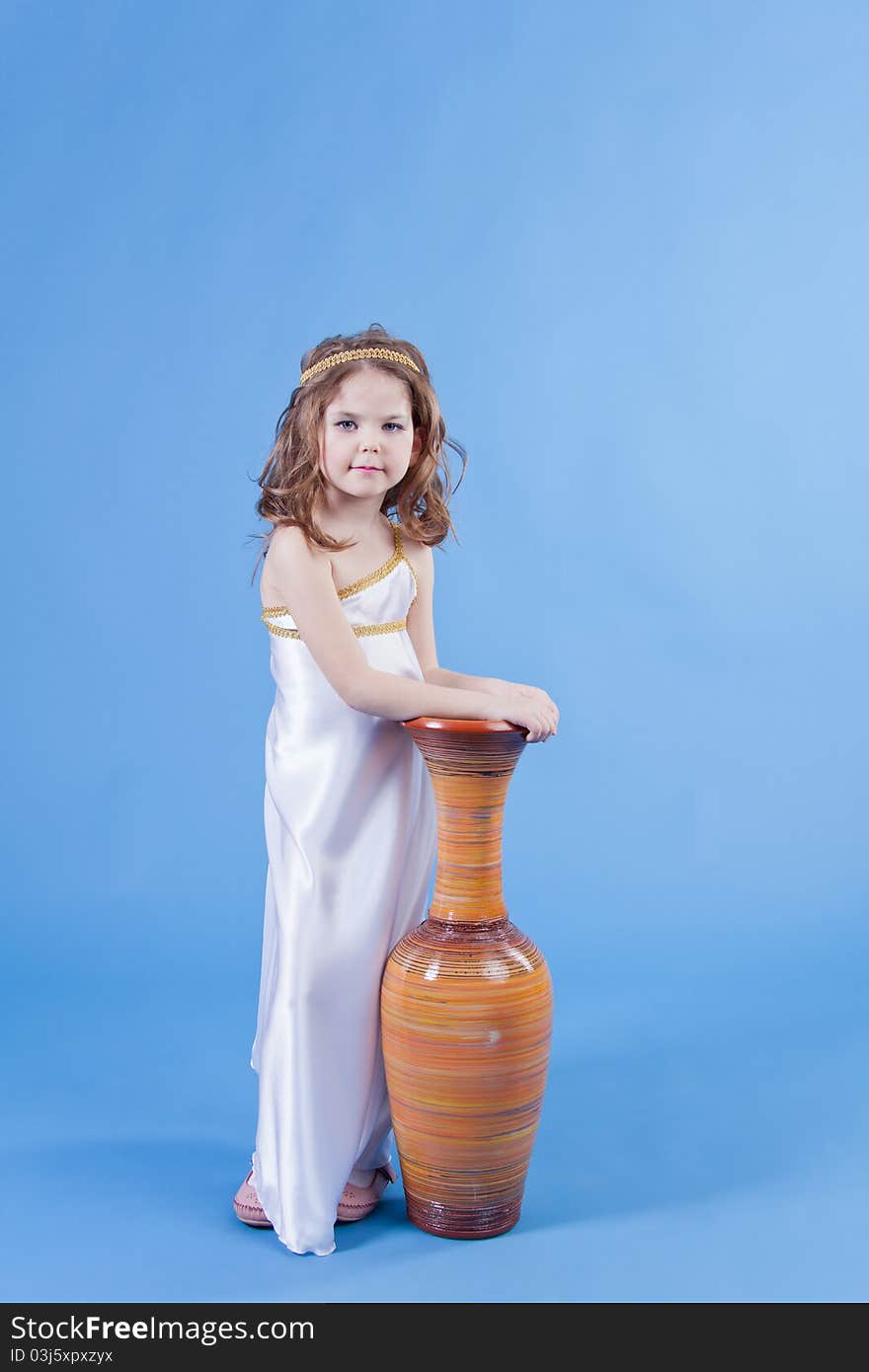 Beautiful girl in the dress of the goddess is about the vase