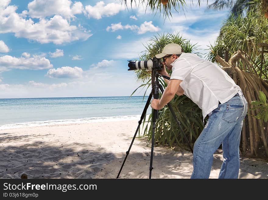 Portrait of photographer taking picture in tropical environment