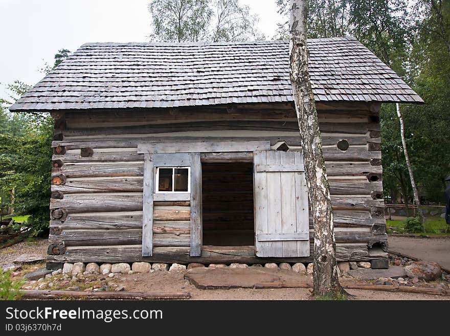 Small wooden hut in the forest.