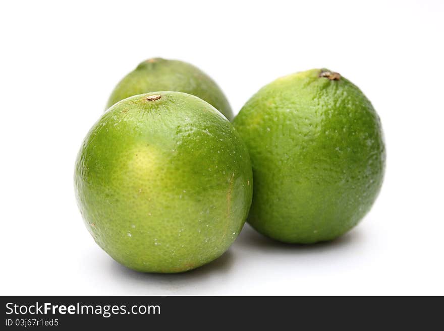 Fresh green limes isolated on white background. Fresh green limes isolated on white background