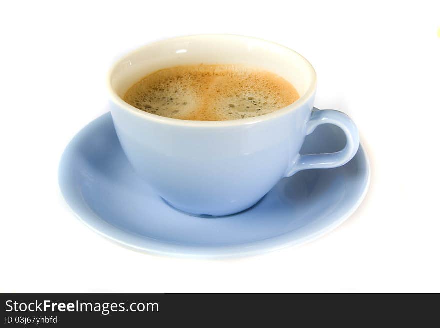 White cup of coffee on wooden table