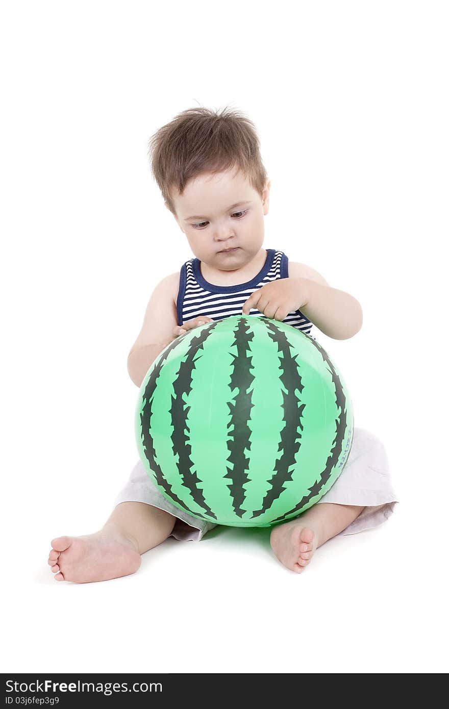 Little boy holding a ball like a watermelon on a white background. Little boy holding a ball like a watermelon on a white background