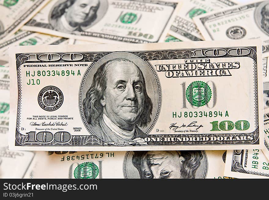 Cash american dollars  lie on dollars background