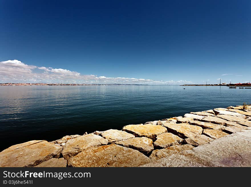 Tejo river with the city of Lisbon in the background. Tejo river with the city of Lisbon in the background.